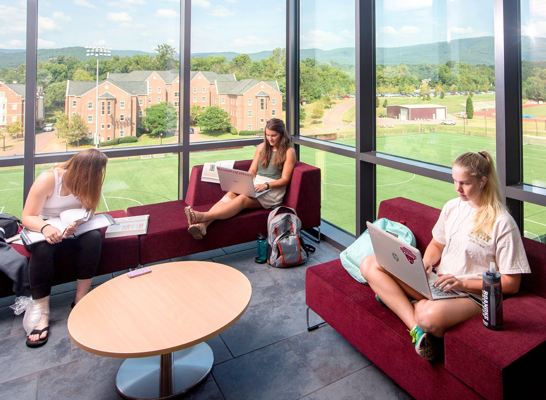 Meeting / study spaces featuring transparent details that overlook the campus and mountain setting beyond.